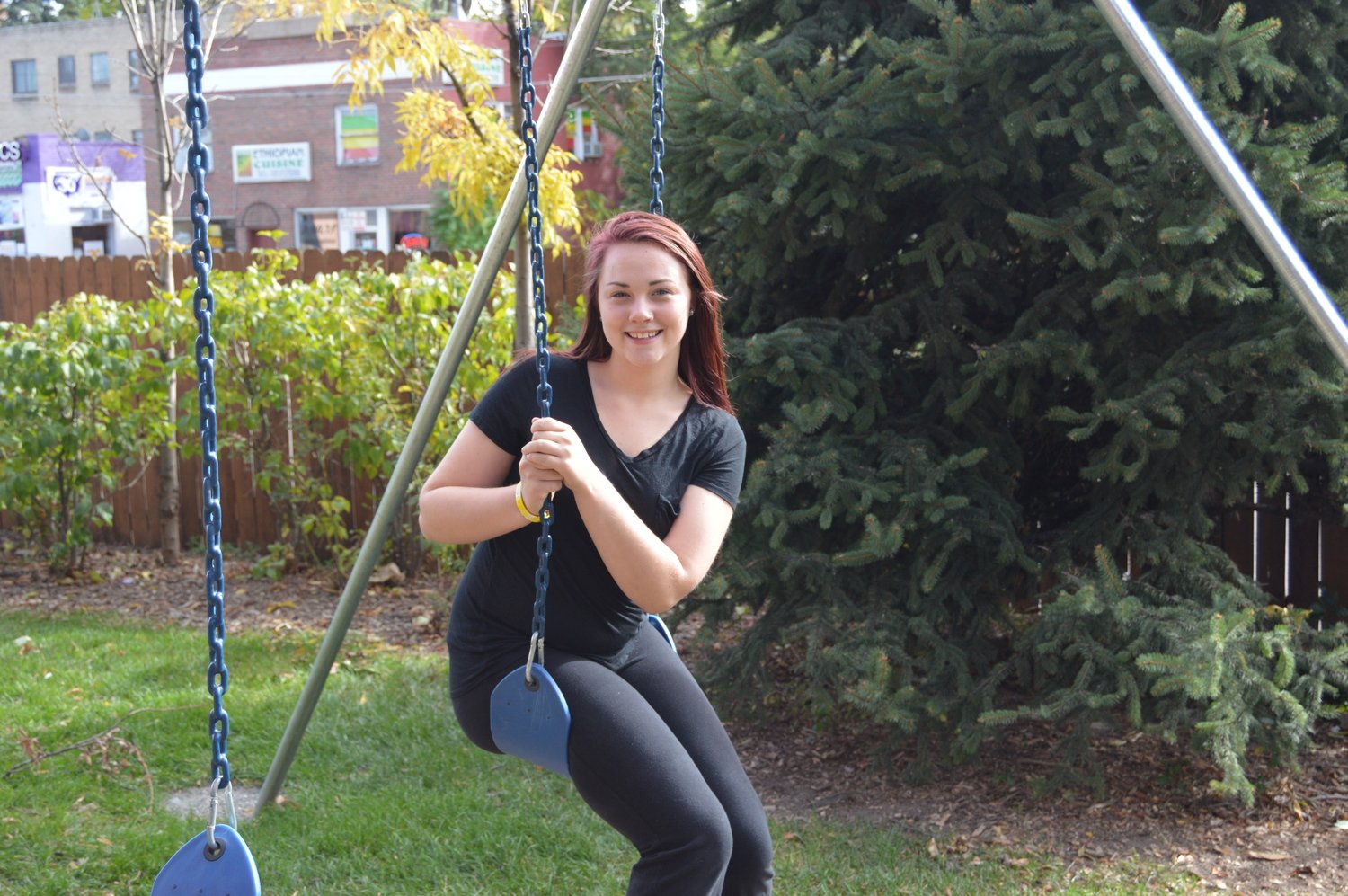 A swing set and climbing wall gives kids an opportunity to play.